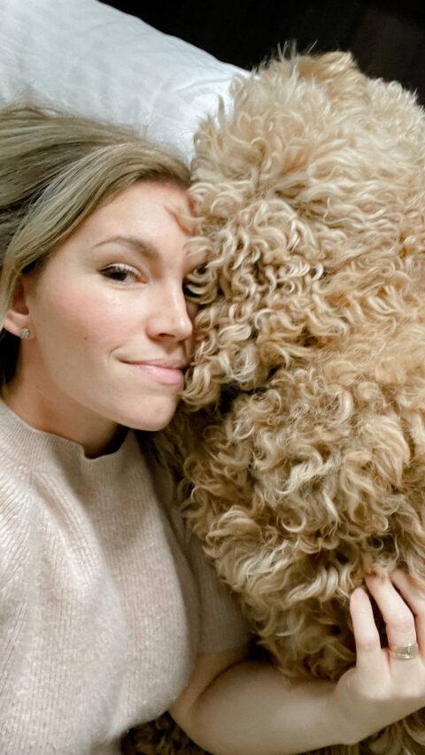 snuggling a goldendoodle